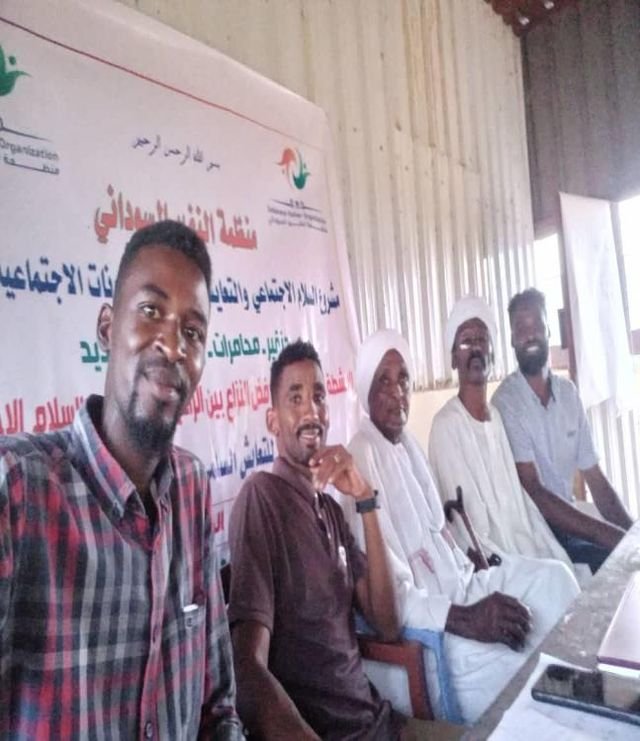 Youth volunteers with community elders