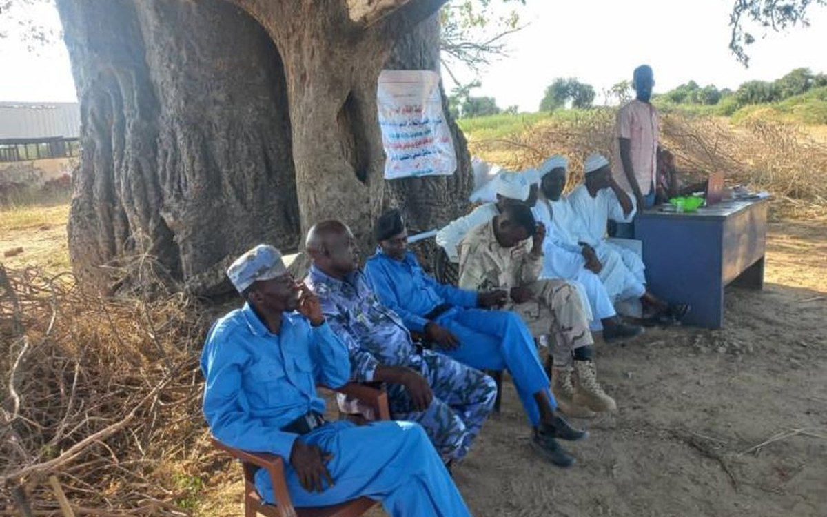 Community members seated together during a dialogue session